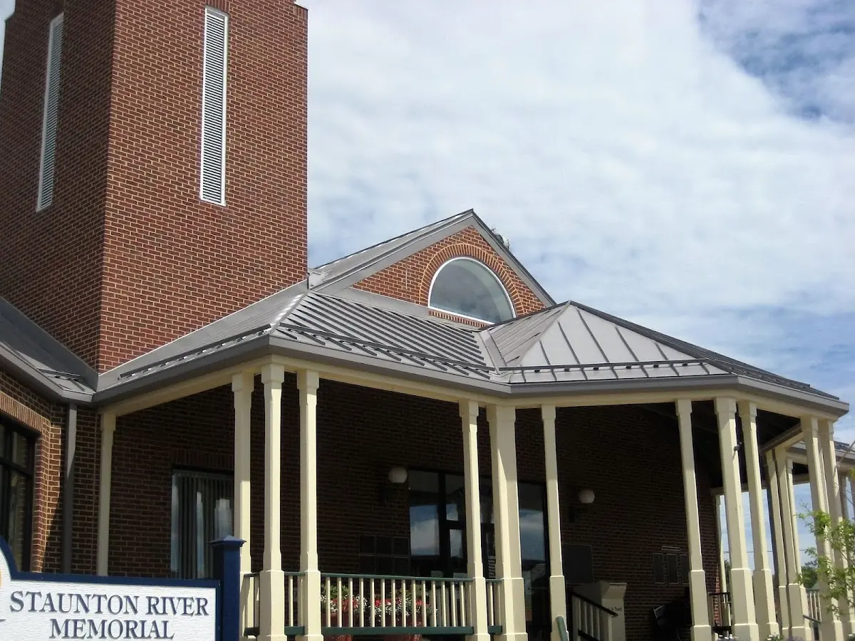 Skilled roofing craftsmen working on a residential roof in Gwynedd